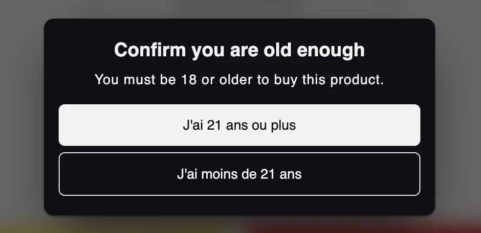 The age gate on a French storefront. The headline and message are in English while both buttons read J'ai 21 ans ou plus and J'ai moins de 21 ans in French.